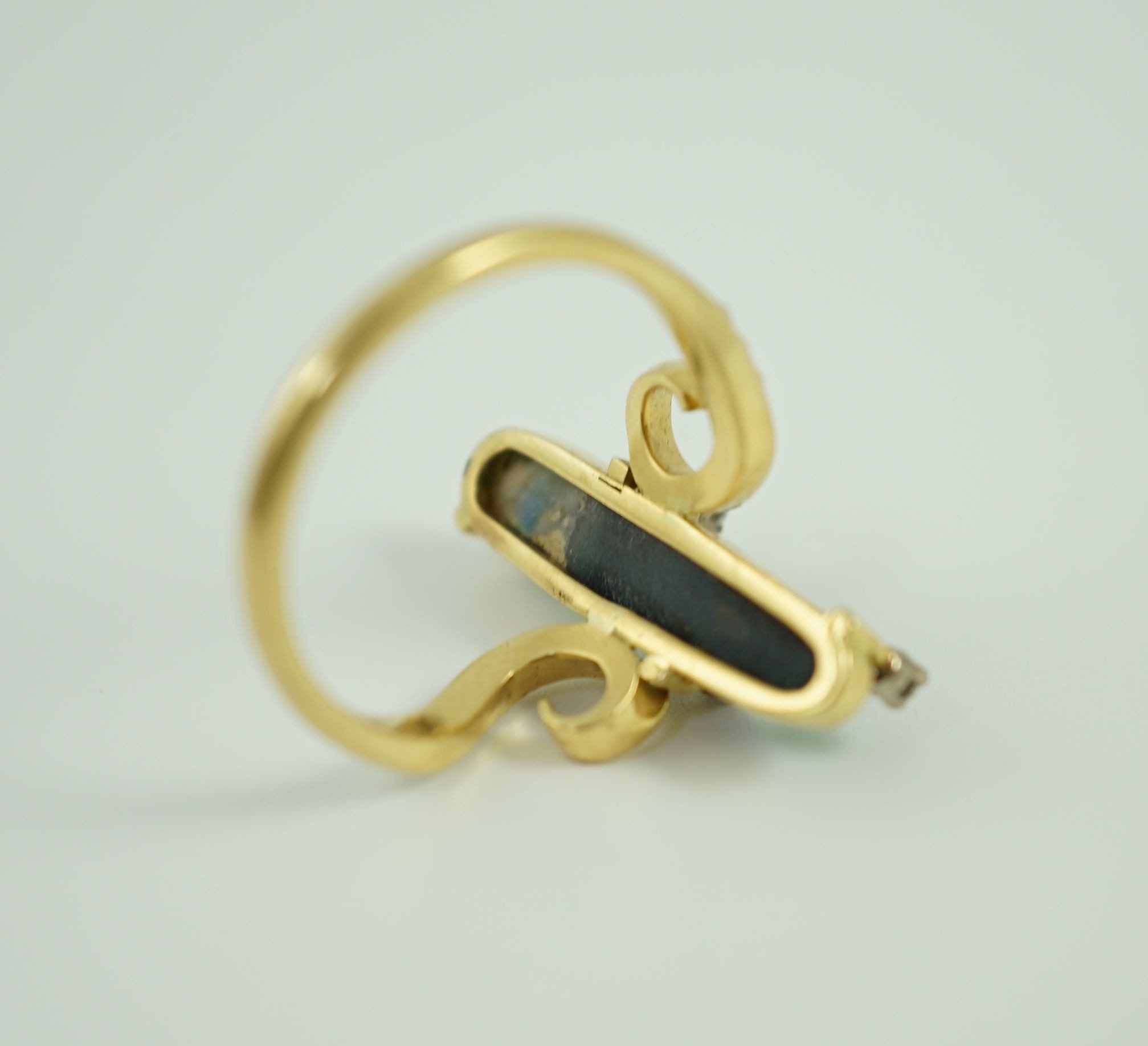 A stylish early to mid 20th century 18ct gold, black opal and diamond chip set dress ring